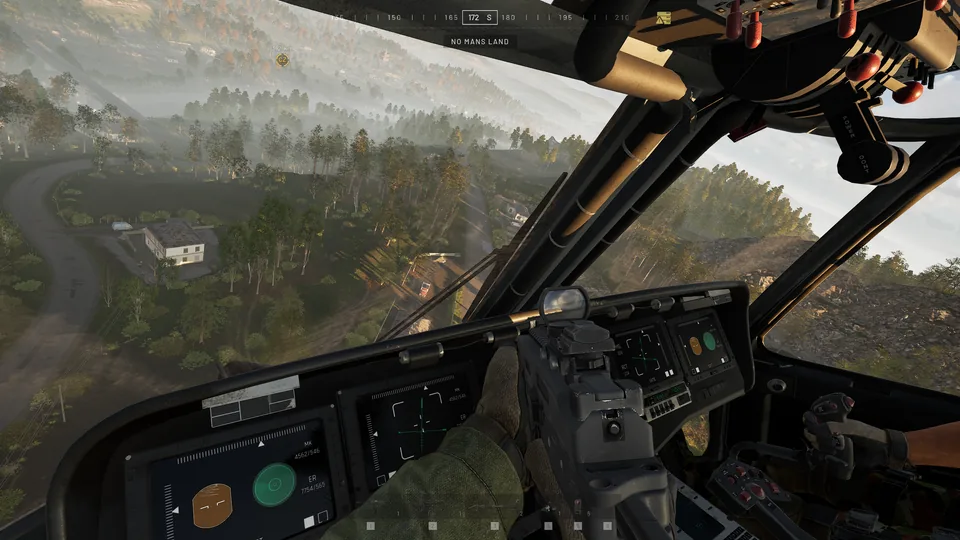 View from a transport helicopter's cockpit over wooded hills and a winding road. The label under the compass reads NO MANS LAND.